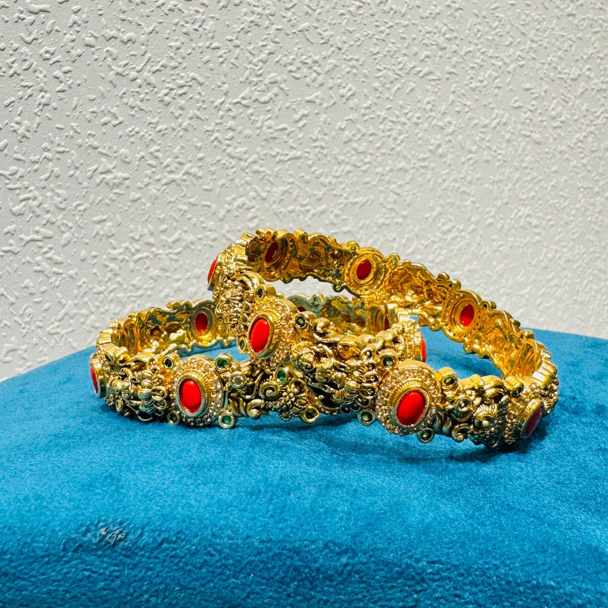 Ornate orange stone god design golden kadda bangels