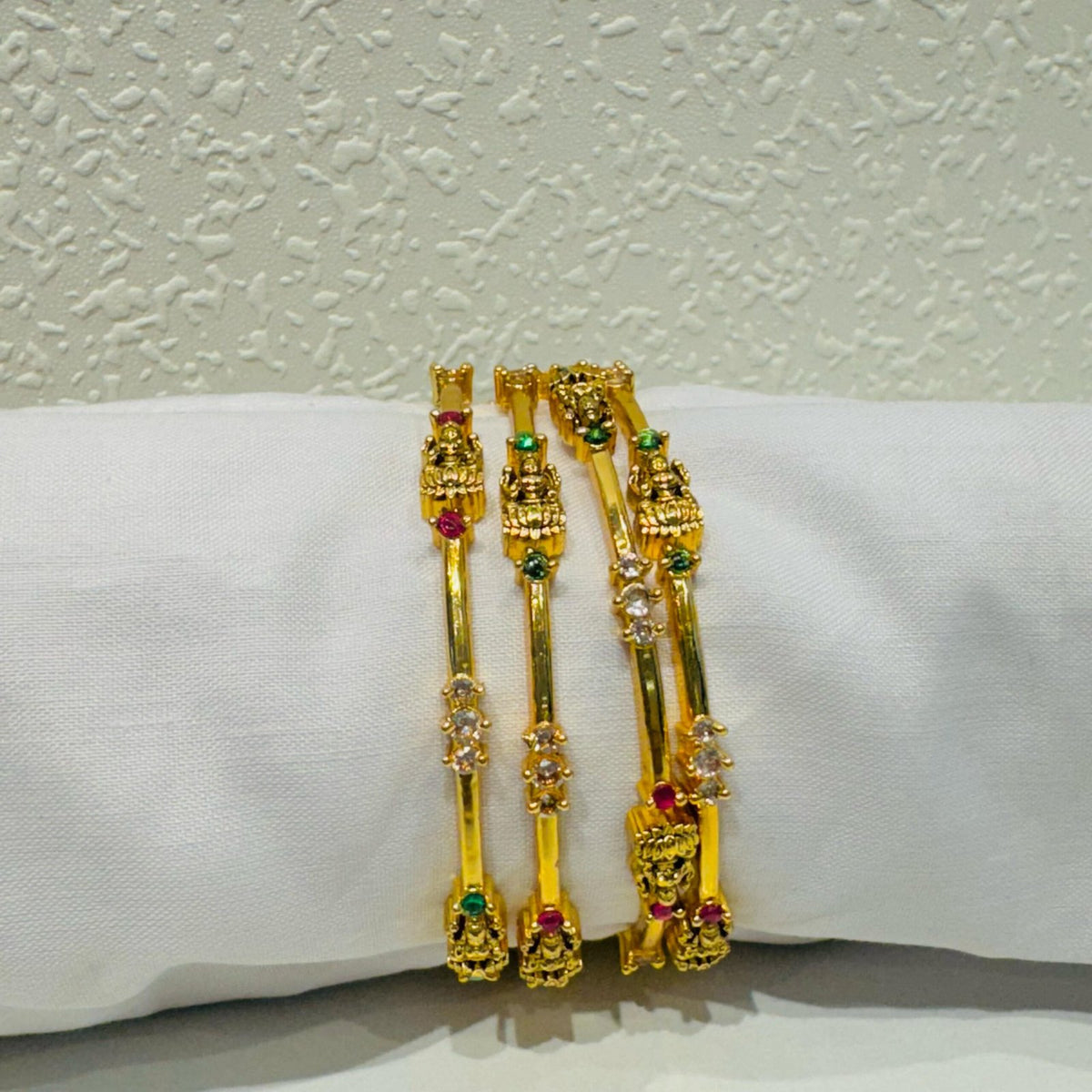 Captivating laxmi with green and red stone golden bangels