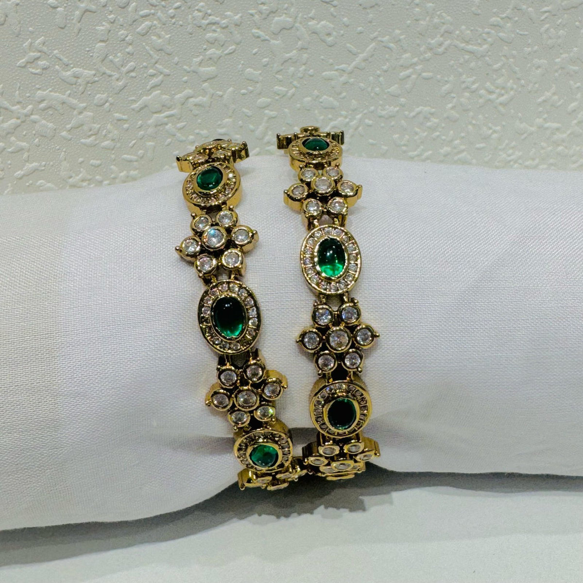 Sought emerald and ad stone floral bangels