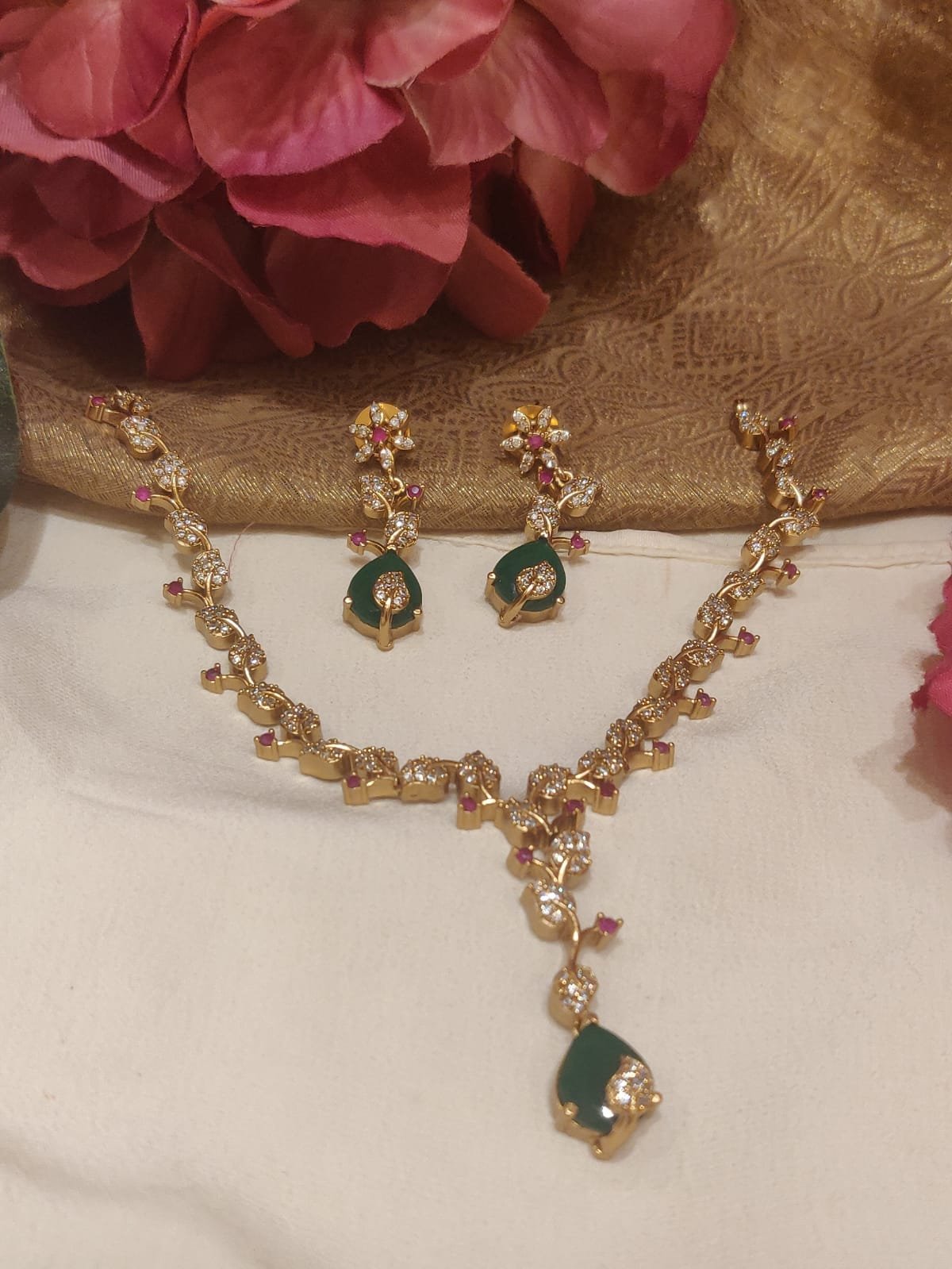 Graceful droplet styled with green stone gold finish ad leaf necklace short