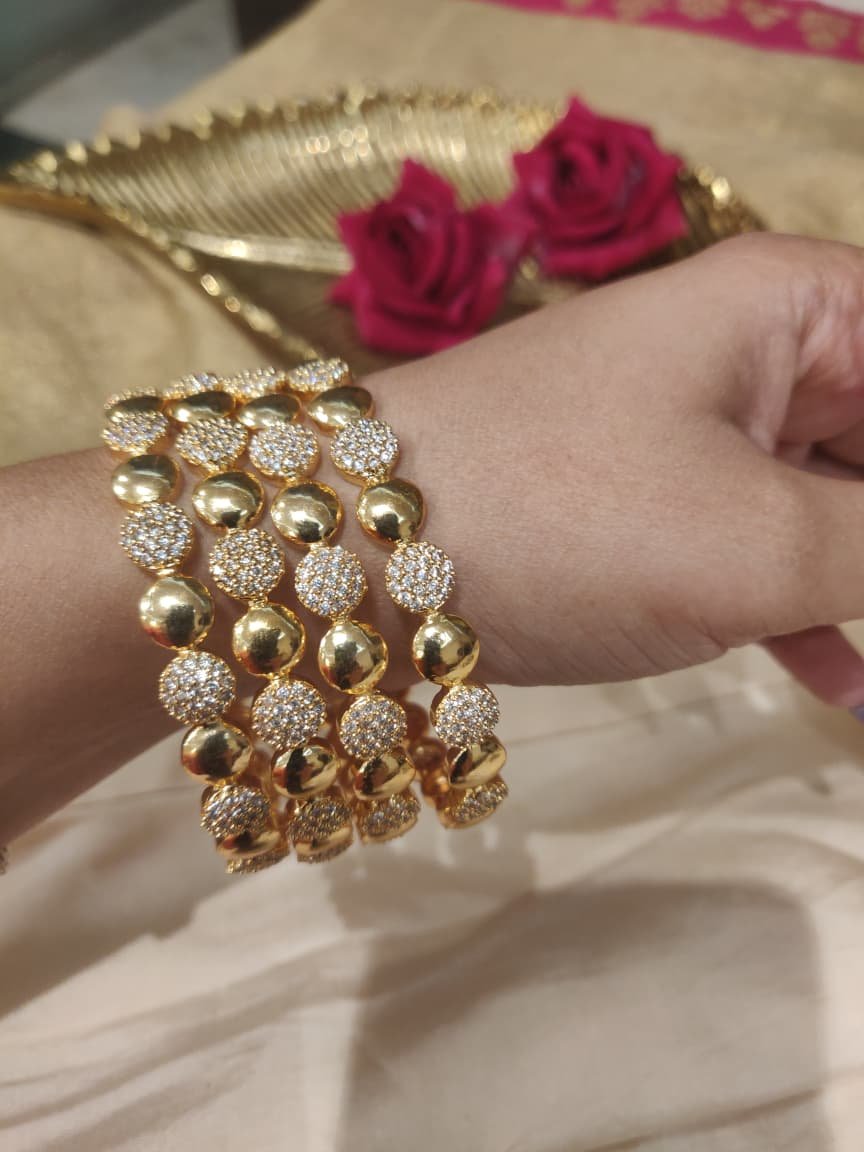 Elegant round ad stone golden round bangle set of 4
