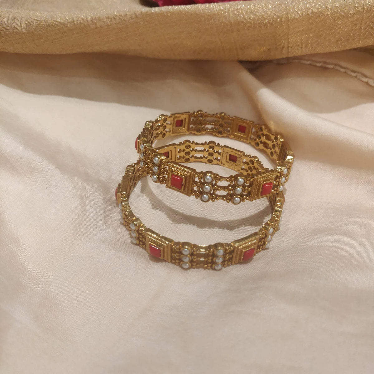 Jubilant rare coral with pearls bangles