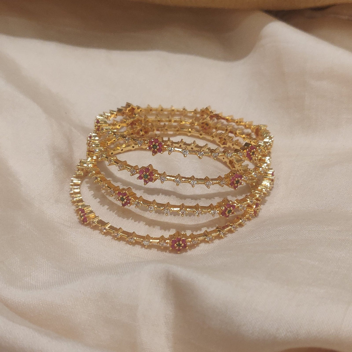 Whimsical tulip with ad stone golden bangels