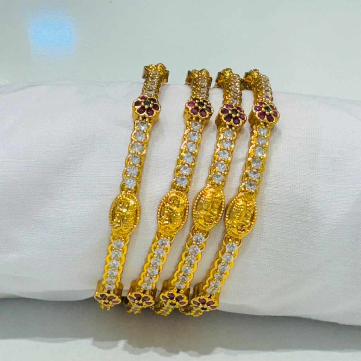 Sought ad stone and red blood golden design bangels