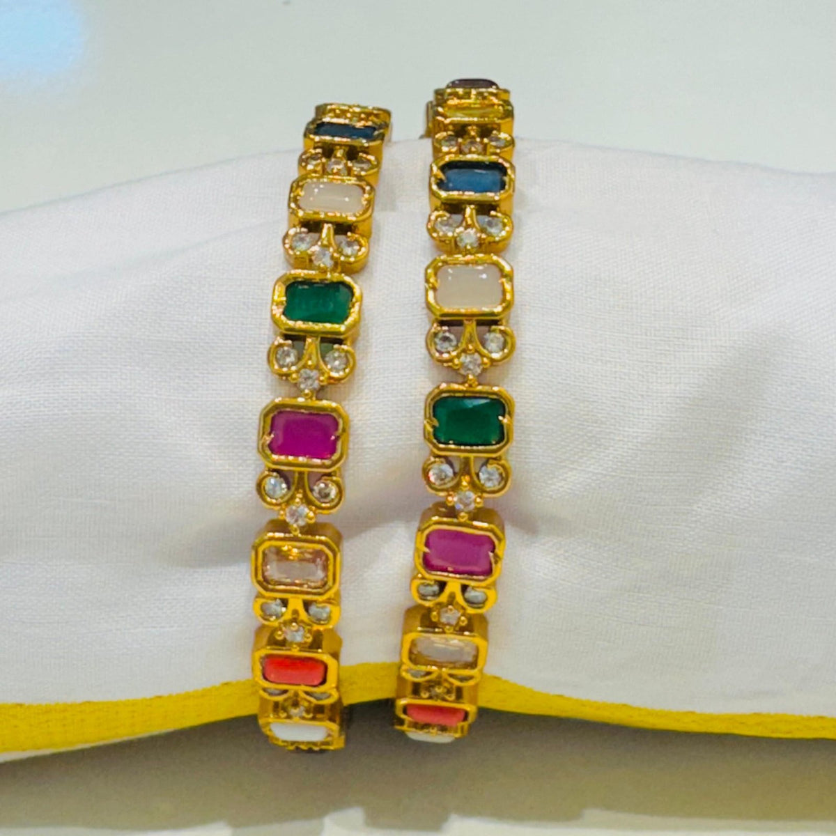 Brilliant multi color stone and ad stone golden bangels