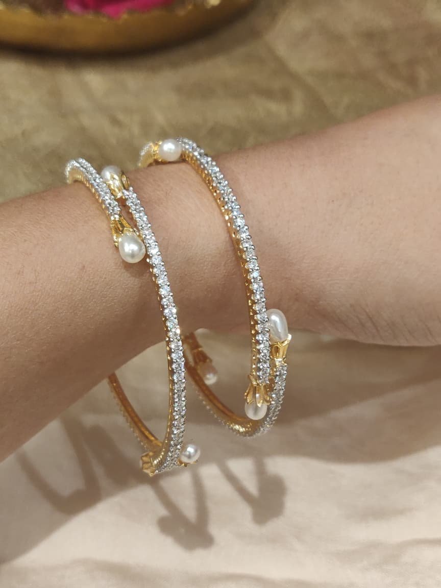 Alluring ad stone bangles with white pearl