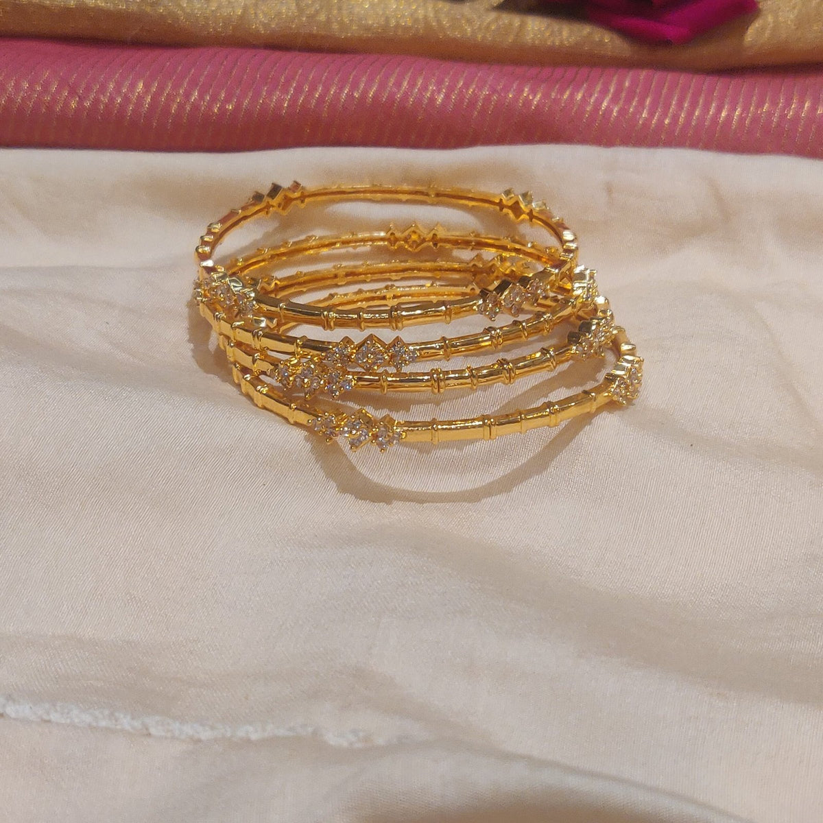 Regal boxy design with ad stone golden bangles