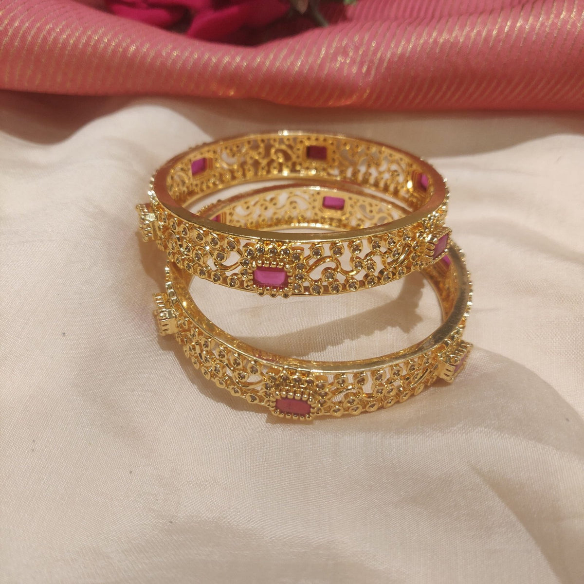 Glamorous ruby stone with leafy design golden bangles