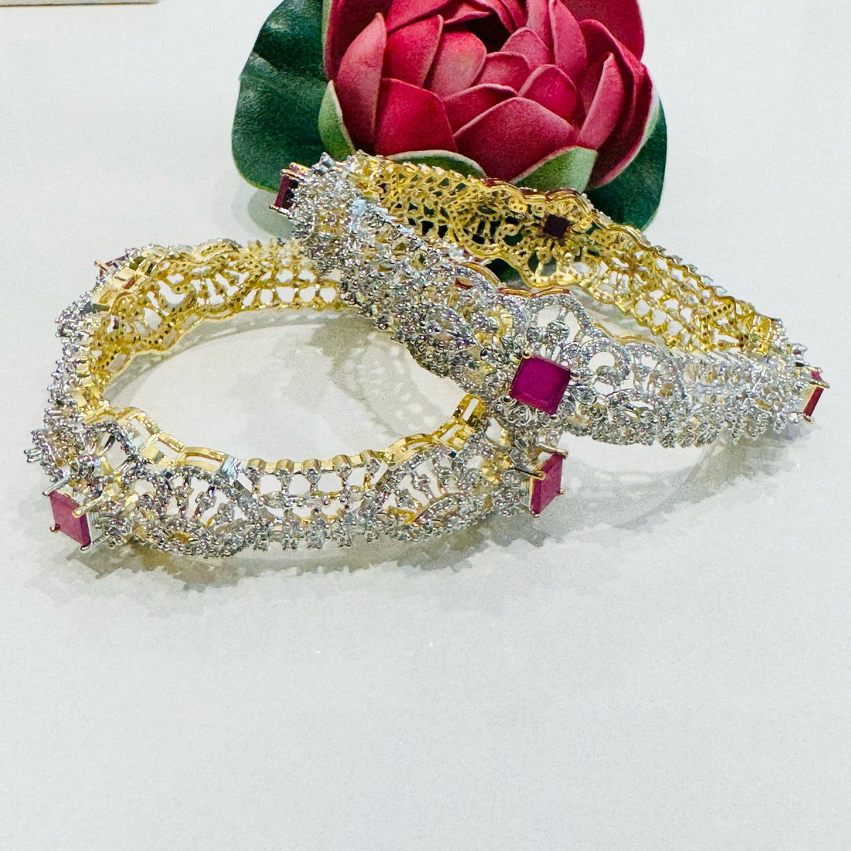 Dazzling ruby stone with ad stone gold and silver design bangels