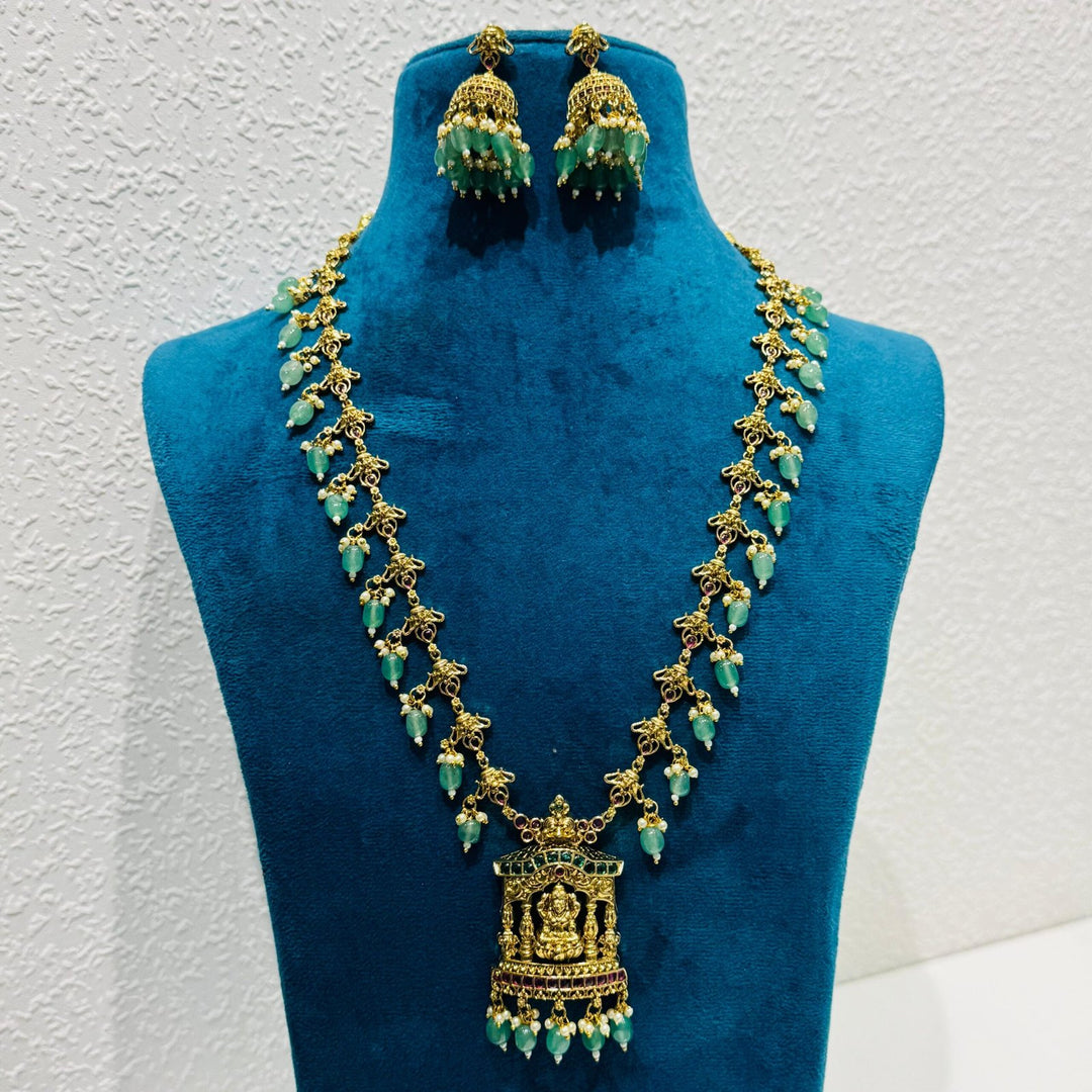 Opulent green bids with golden design with laxmi pendant necklace
