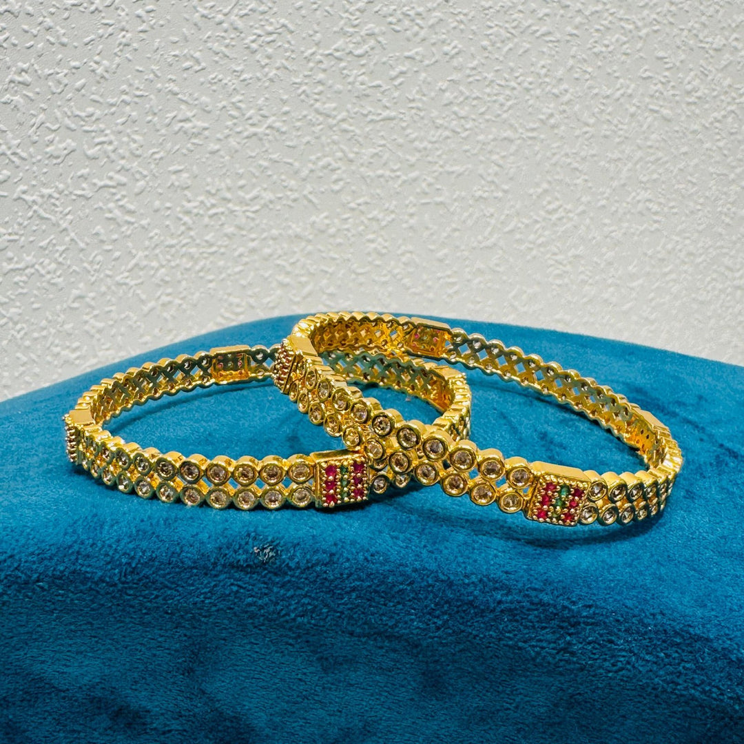 Elegant ad stone and red diamond and green stone golden bangels