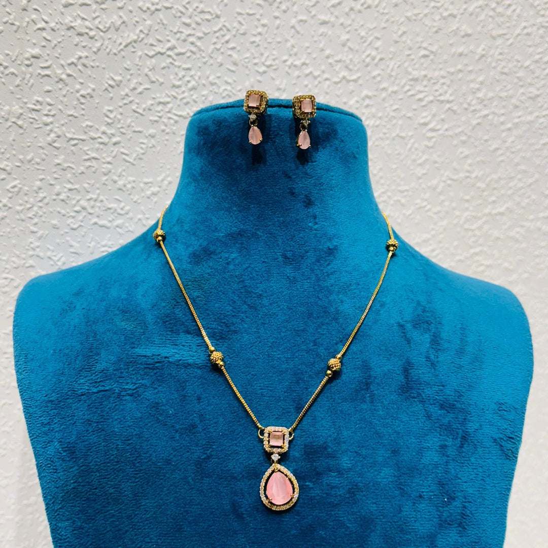Pinnacle Artisanal  Radiant pink rose stone with golden chain necklace