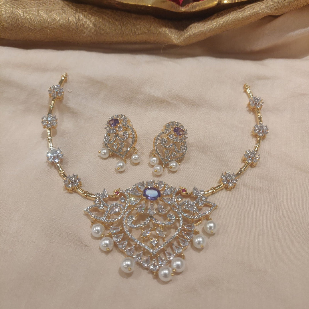 Trendsetting Timeless floral design with purple  stone with pearls and golden choker necklace