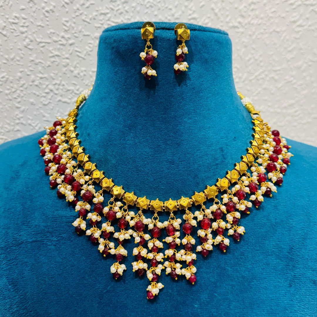 Lustrous jhumar pearls and red moti choker necklace