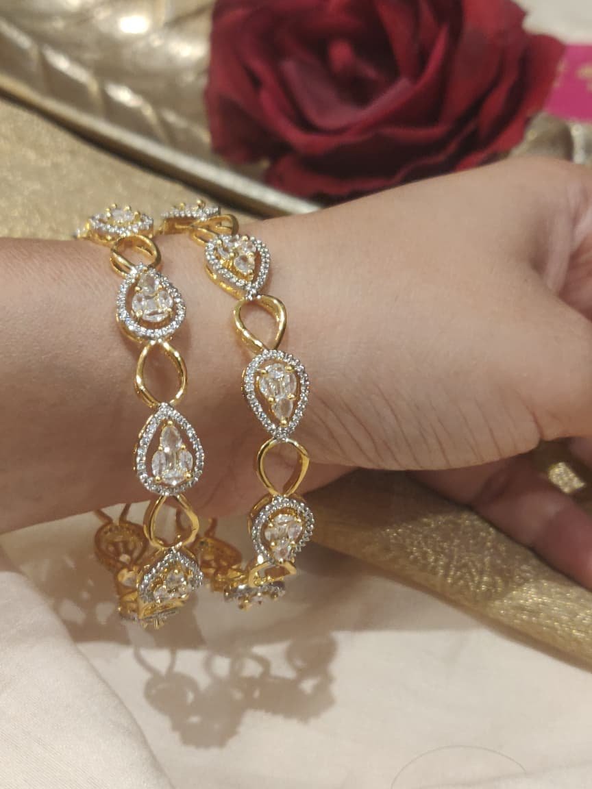 Opulent golden cystal stone bangles set of 2