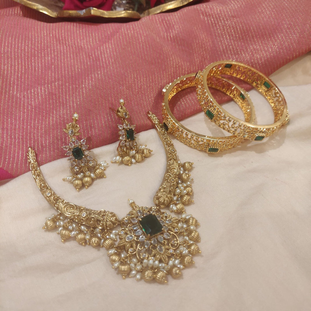 Sparkling emerald with pearls and golden choker necklace with combo bangels