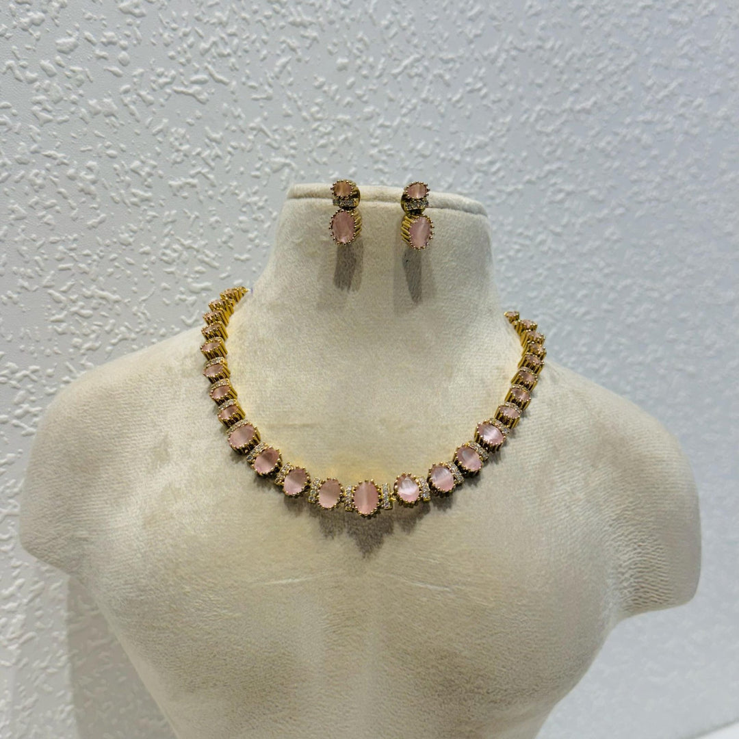 Glamorous pink rose stone with ad joints golden necklace