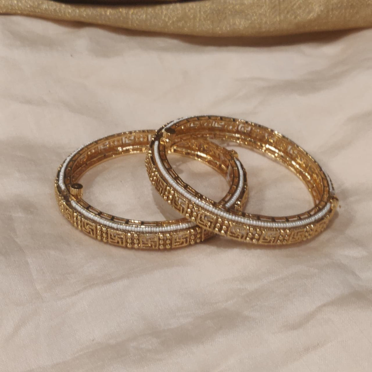 Graceful white beads outline bangles set of 2
