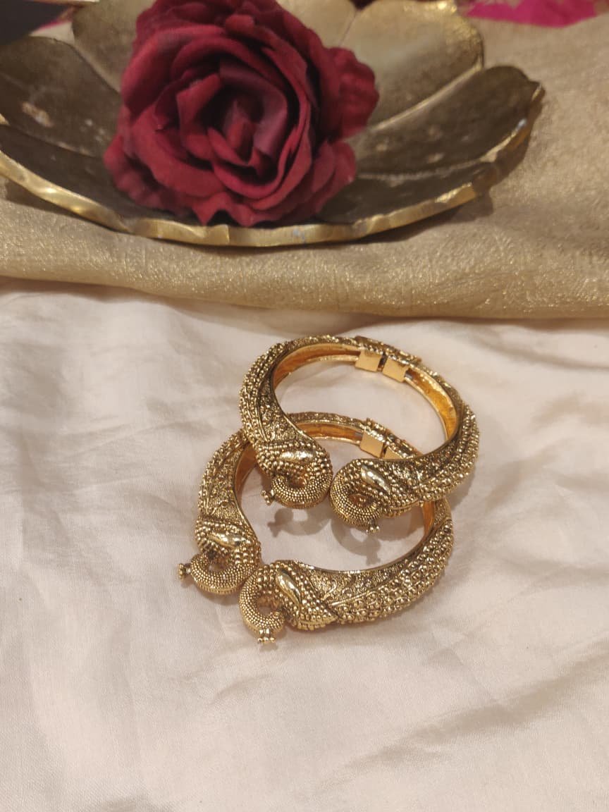 Sparkling golden peacock bangles set of 2