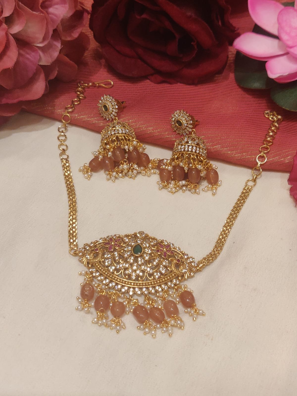 Opulent gold plated peacock design pink beads styled ad chain choker