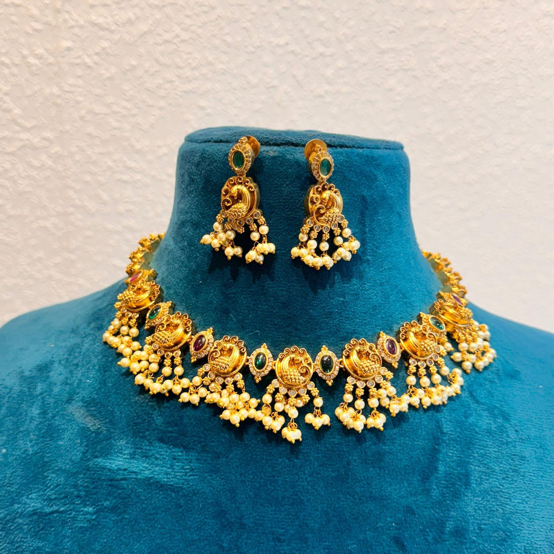 Regal bridal peacock golden choker with perals and emerald &amp; ruby stone necklace