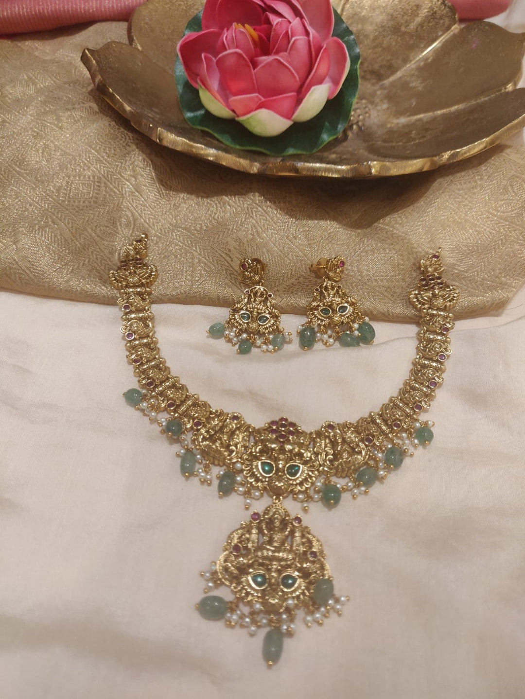 Sparkling Golden Lakshmi Short Necklace With Lightgreen Beads