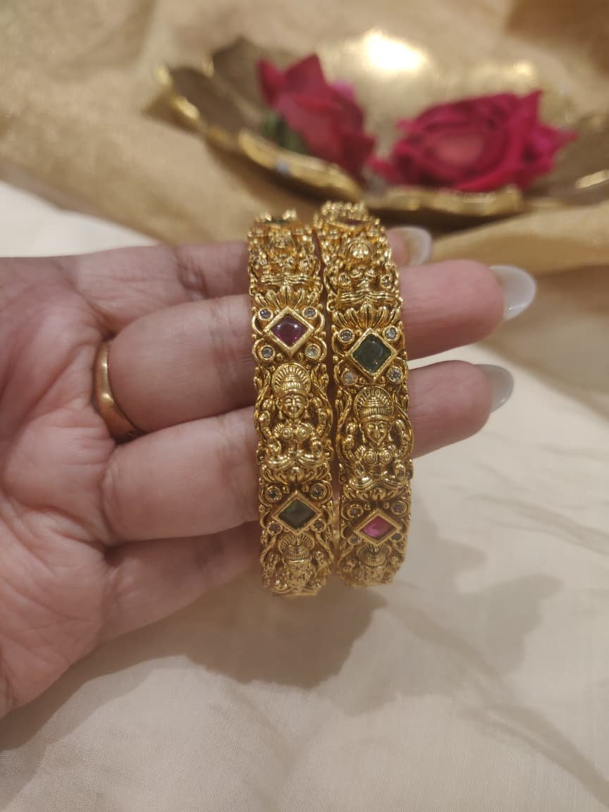 Timeless lakshmi bangles with green ruby ad stone
