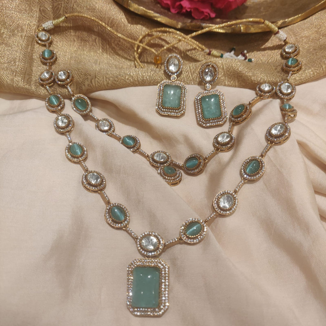 Elegant Dazzling sky blue  stone with ad stone golden necklace