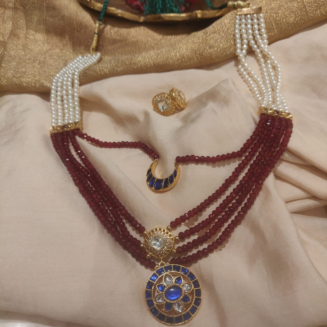 Lustrous red moti with pearls and half moon with sun bridal haar