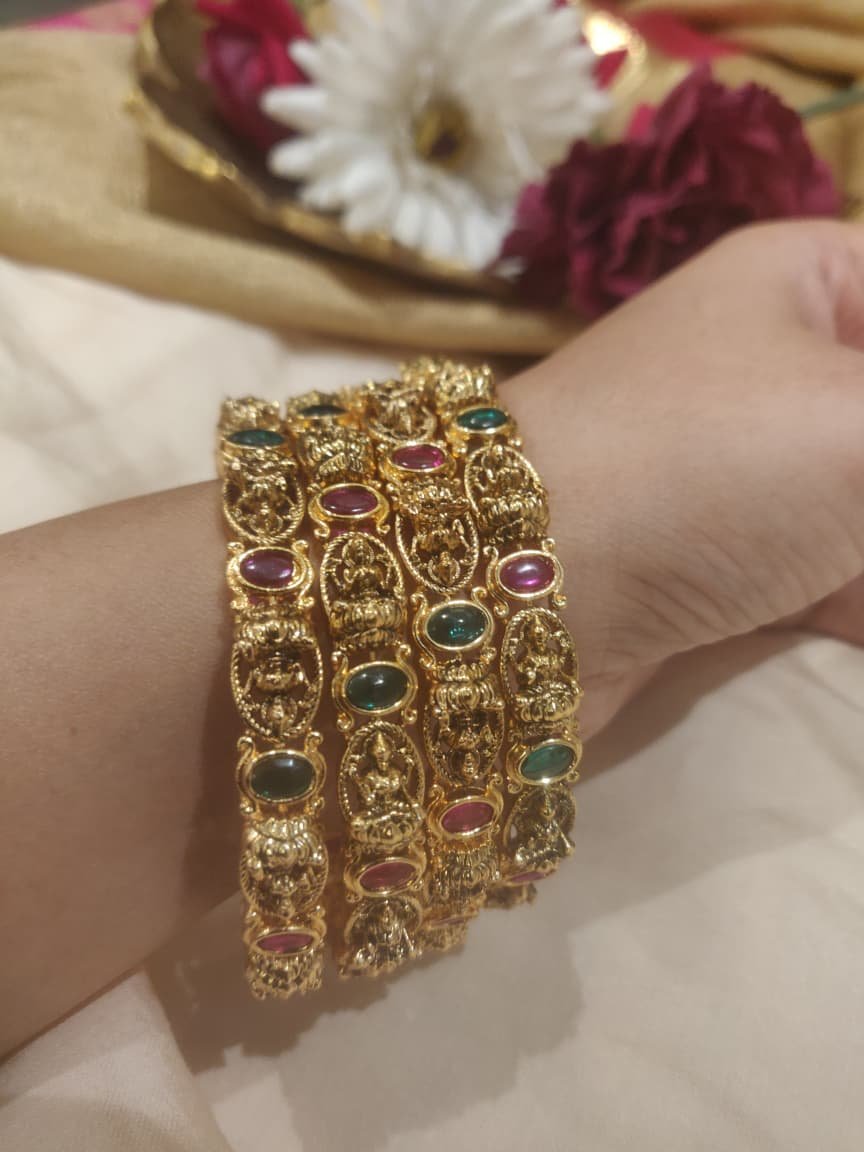Enchanting lakshmi bangles with red green ad stones