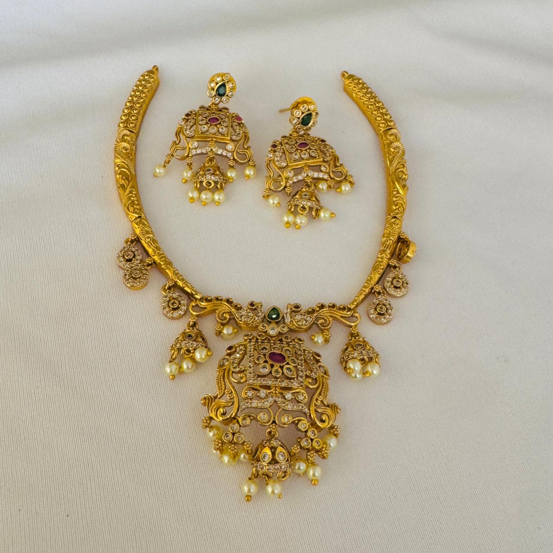 Scintillating Golden Floral Neckalce with White Beads