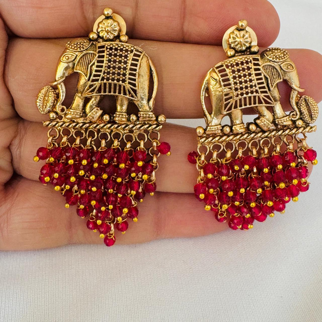 Refined Golden Elephant Earring with Droplet Ruby Stone