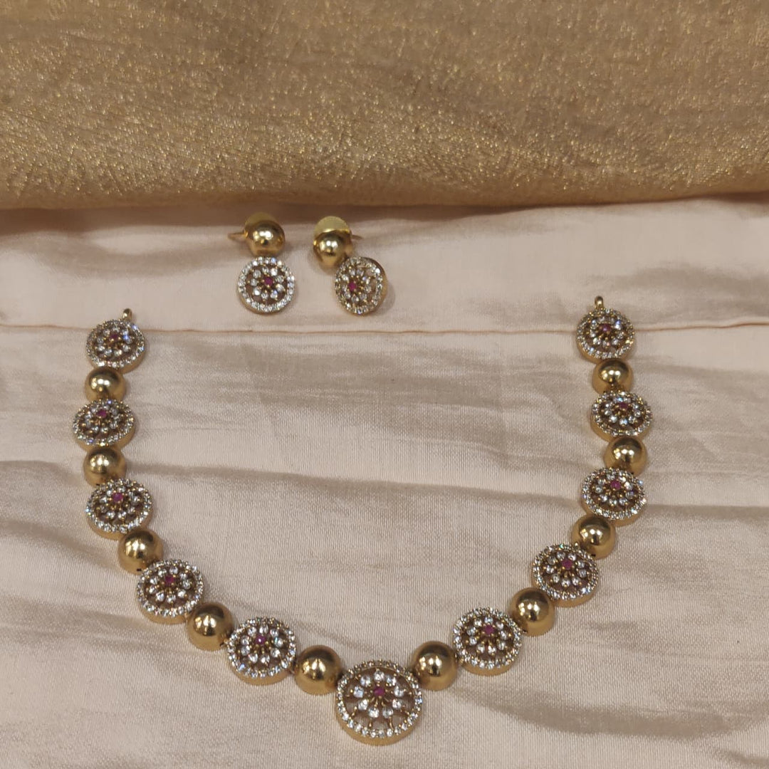 Lustrous Ruby AD Floral Golden Necklace