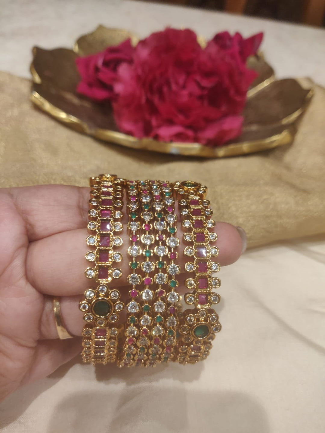 Floral ruby green stone golden set