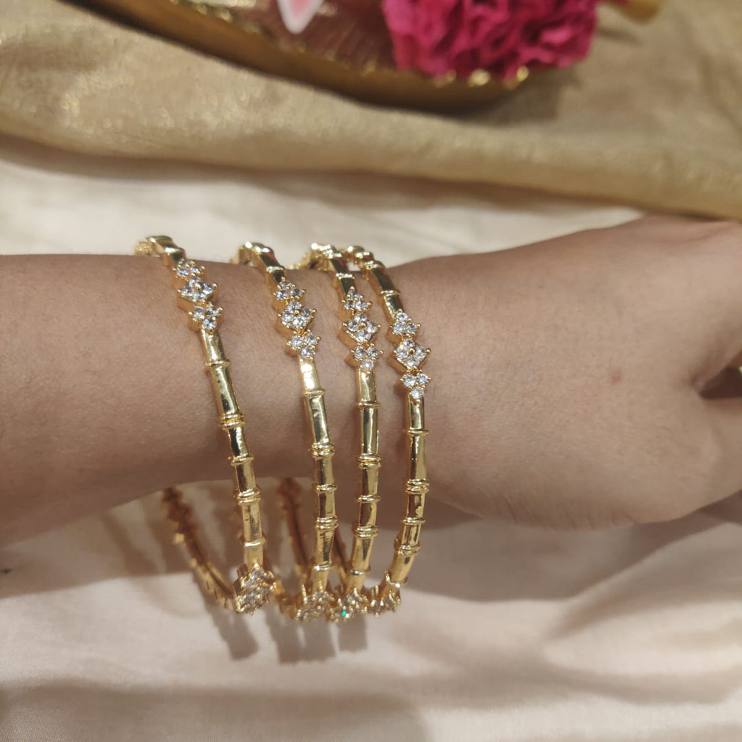 Alluring Golden Bangles with AD Stone Star set of 4