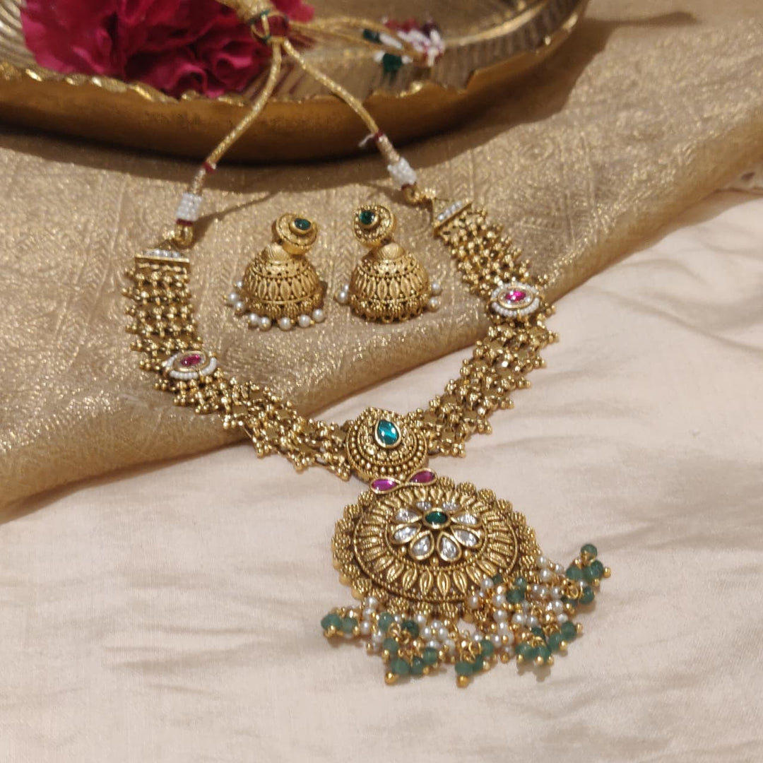 Captivating Gold Pendant Necklace Set with Green Beads and Jhumka