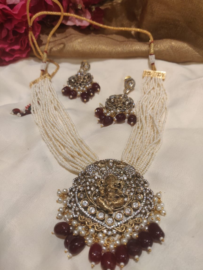 Handcrafted black finish ad brass ganesh pendant bloodred beads styled rani haar