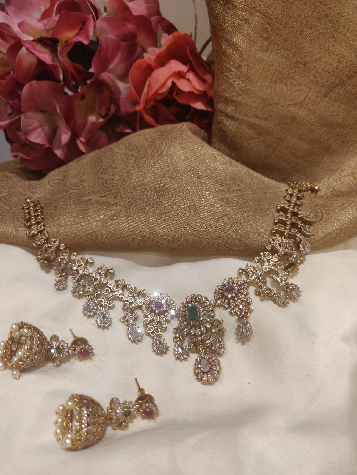 Magnificent gold finish dual colored stone styled designer ad short necklace