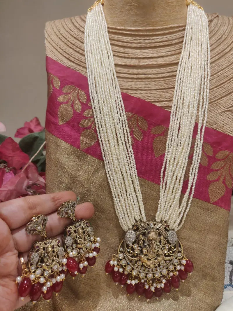 Opulent Handcrafted AD Fitted Ganesh Pendant Red Beads Styled Pearl Haar