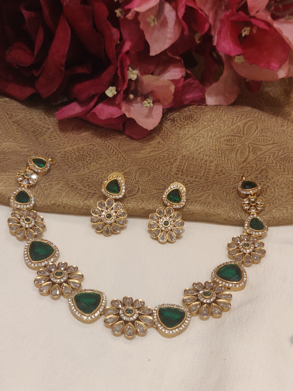 Glamorous gold plated floral design green stone styled short necklace cz