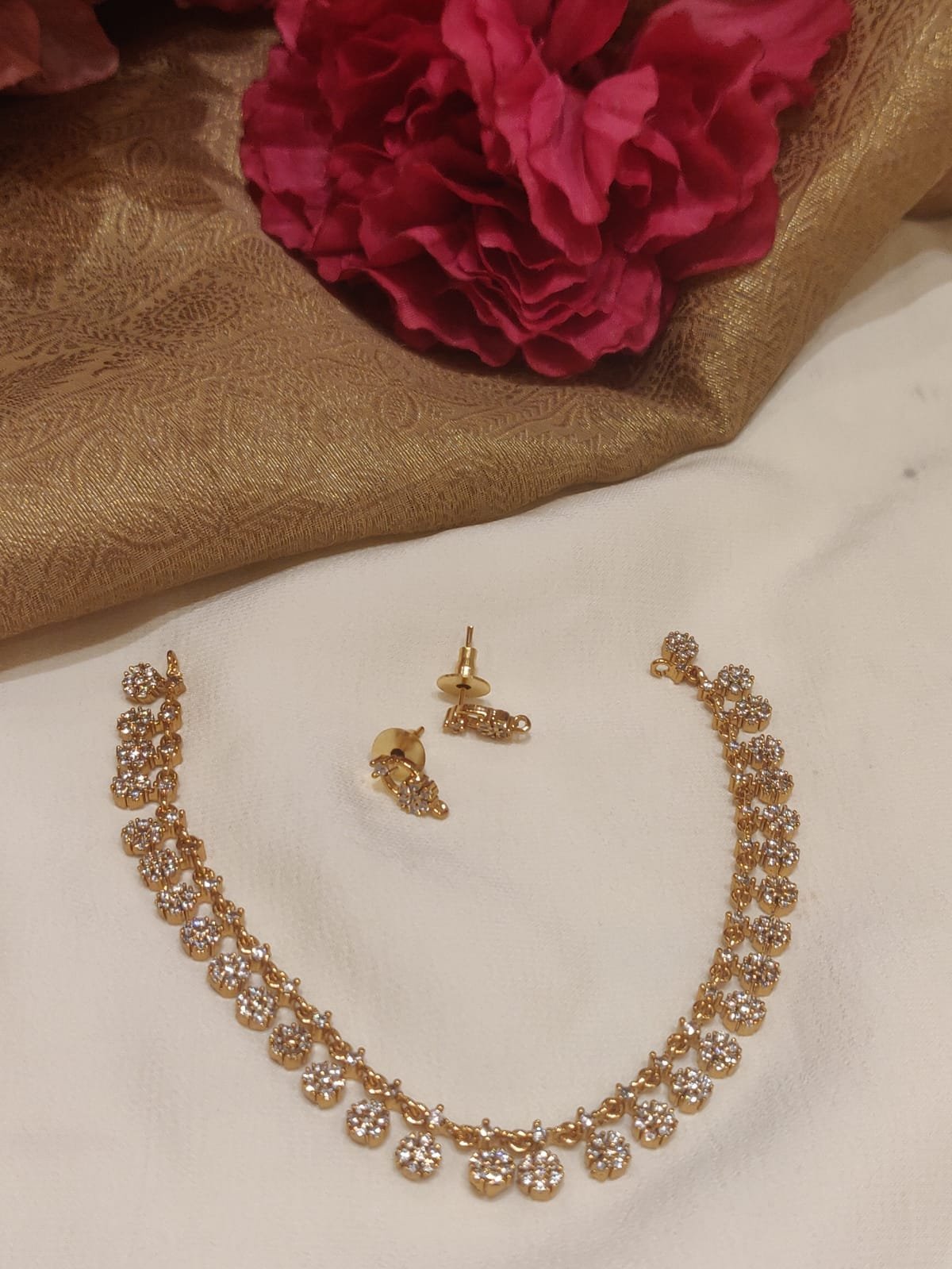 Opulent gold plated floral design ad necklace
