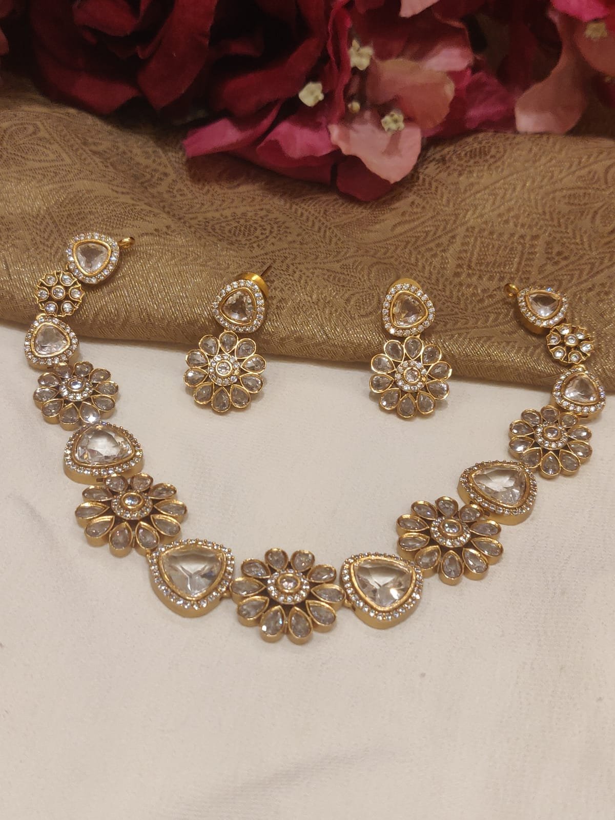 Glamorous gold plated floral design crystal white stone styled short necklace cz