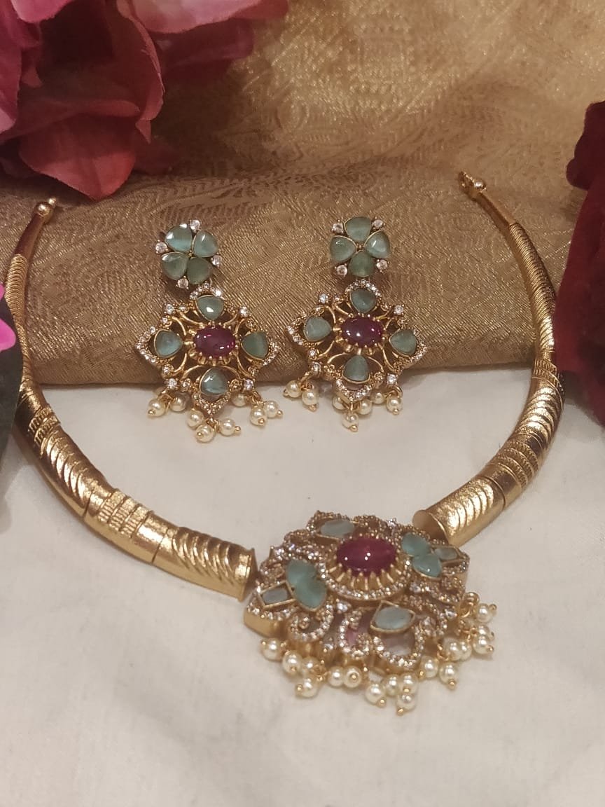 Sparkling Gold Finish Skyblue colored Stone Styled Bridal Hasli Necklace