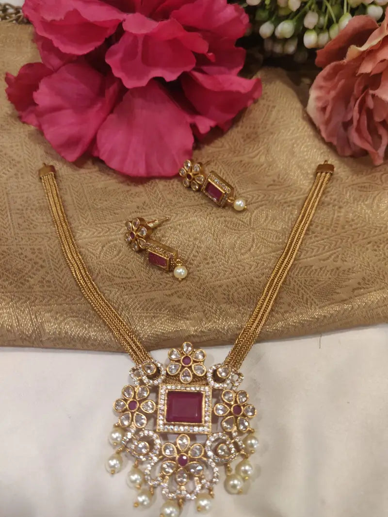 Exotic kundan pendant ruby studded foxtail chain necklace