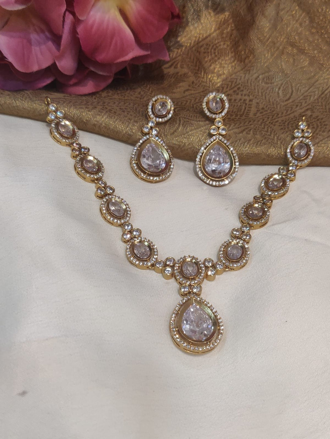 Opulent Gold Finish Crystal Stone Styled AD Fitted Short Necklace