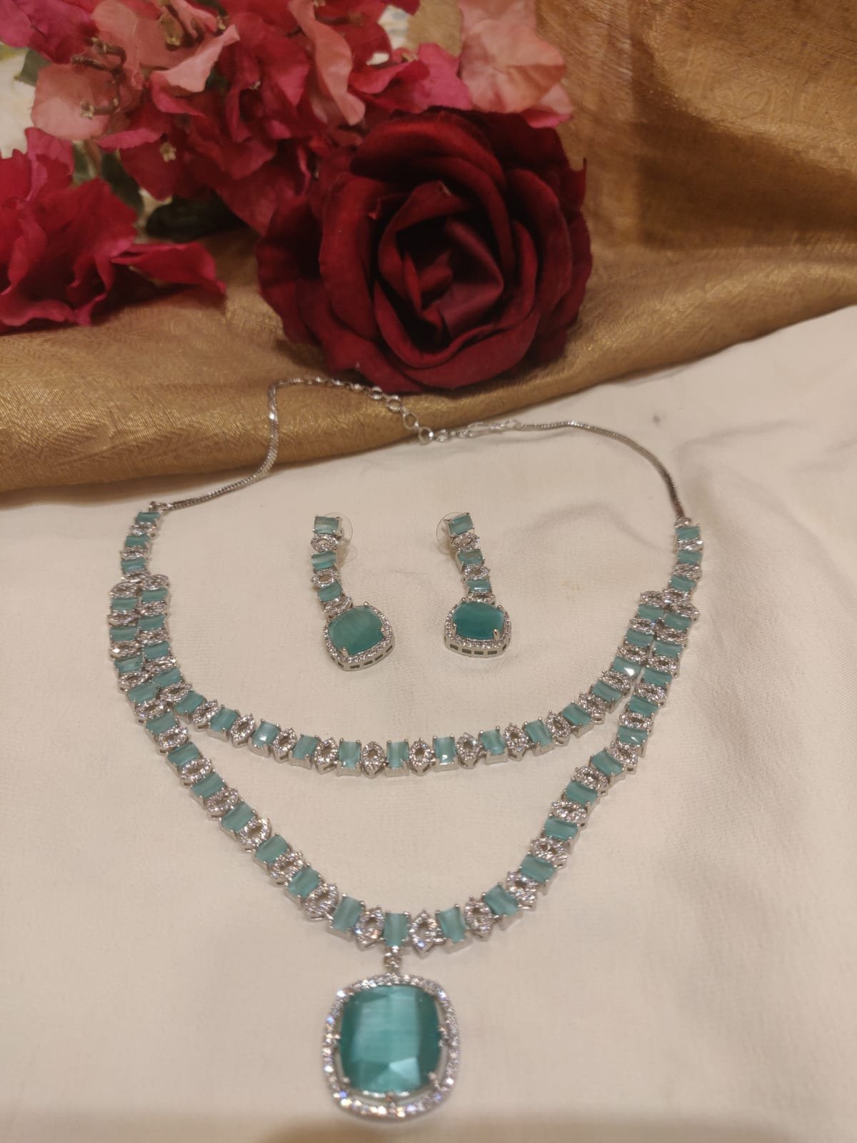Lustrous silevr finish sky blue stone styled pendant layered necklace ad