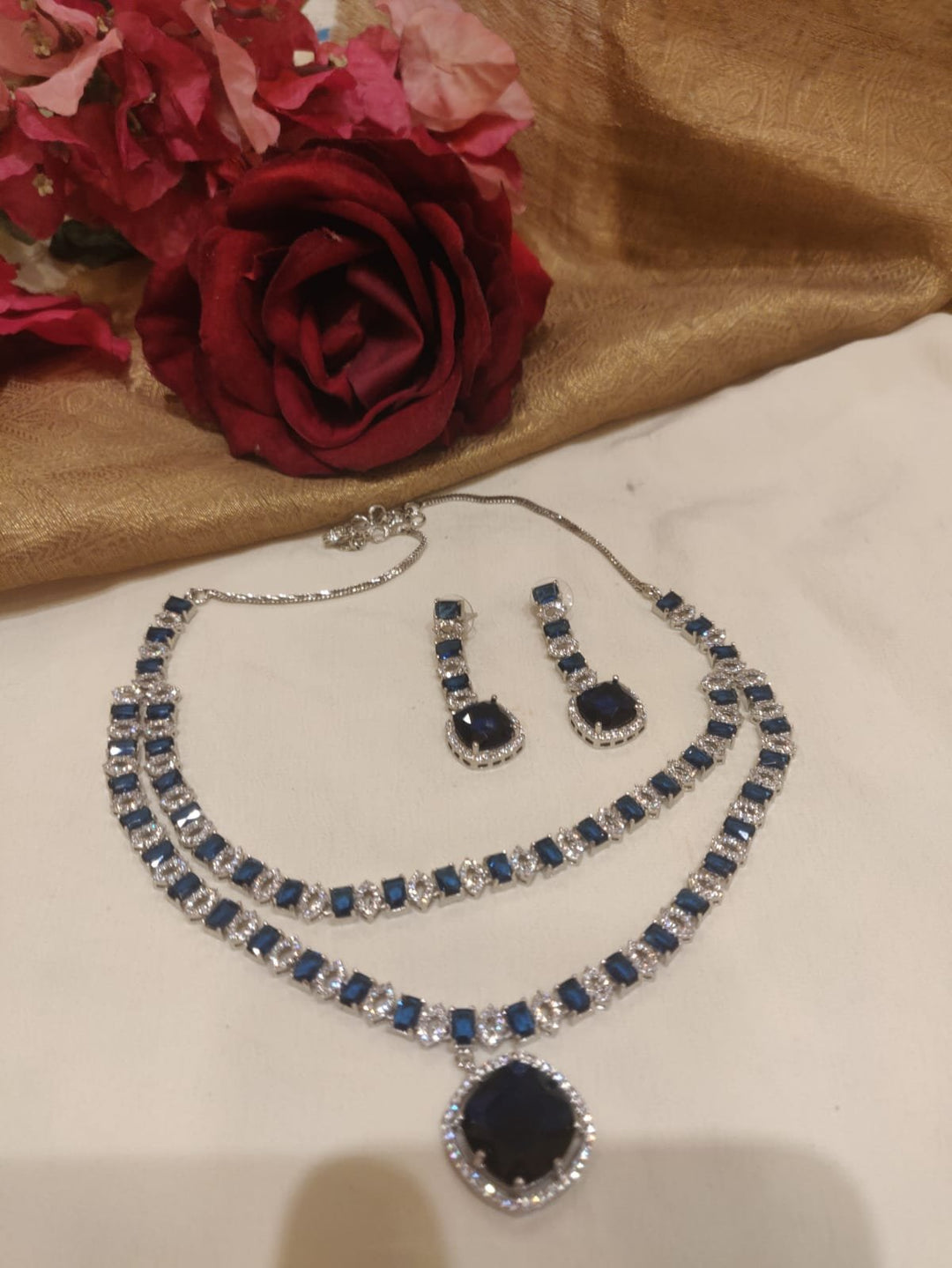 Lustrous Silevr Finish Navy Blue Stone Styled Pendant Layered Necklace AD