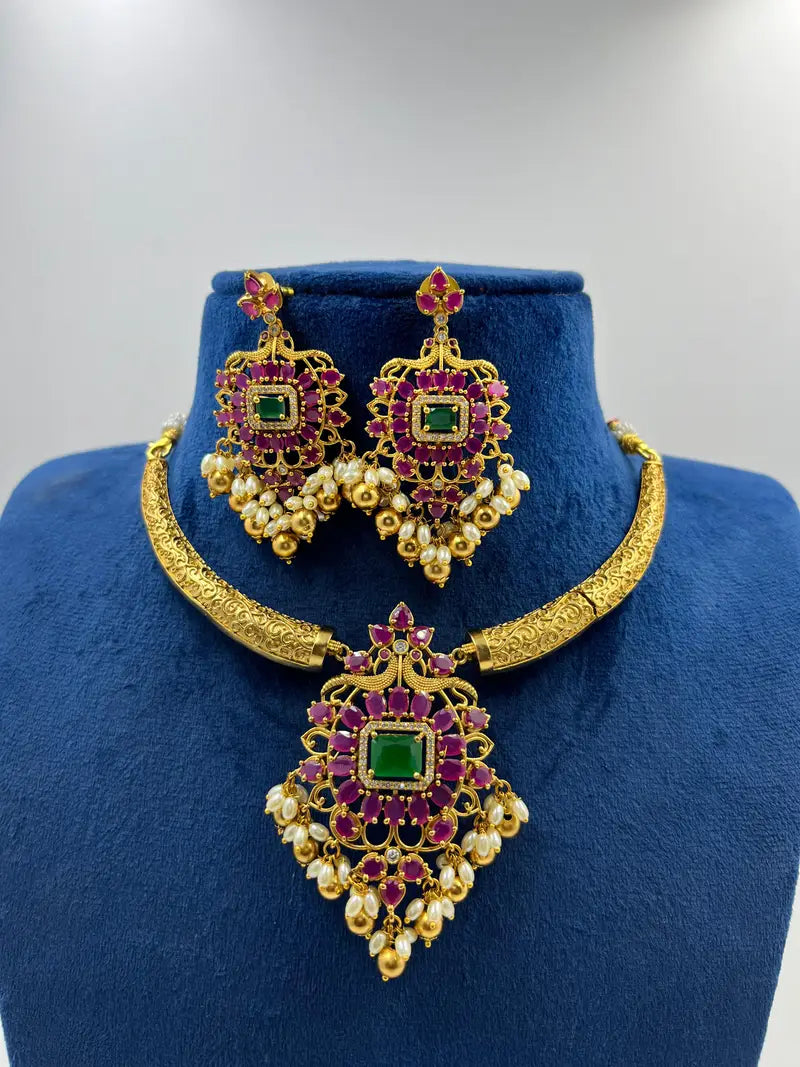Resplendent Gold Plated Ruby Styled Hasli Necklace