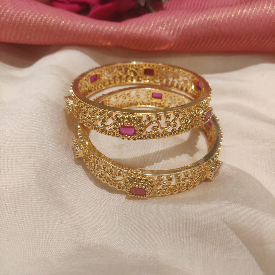 Glamorous ruby stone with leafy design golden bangles