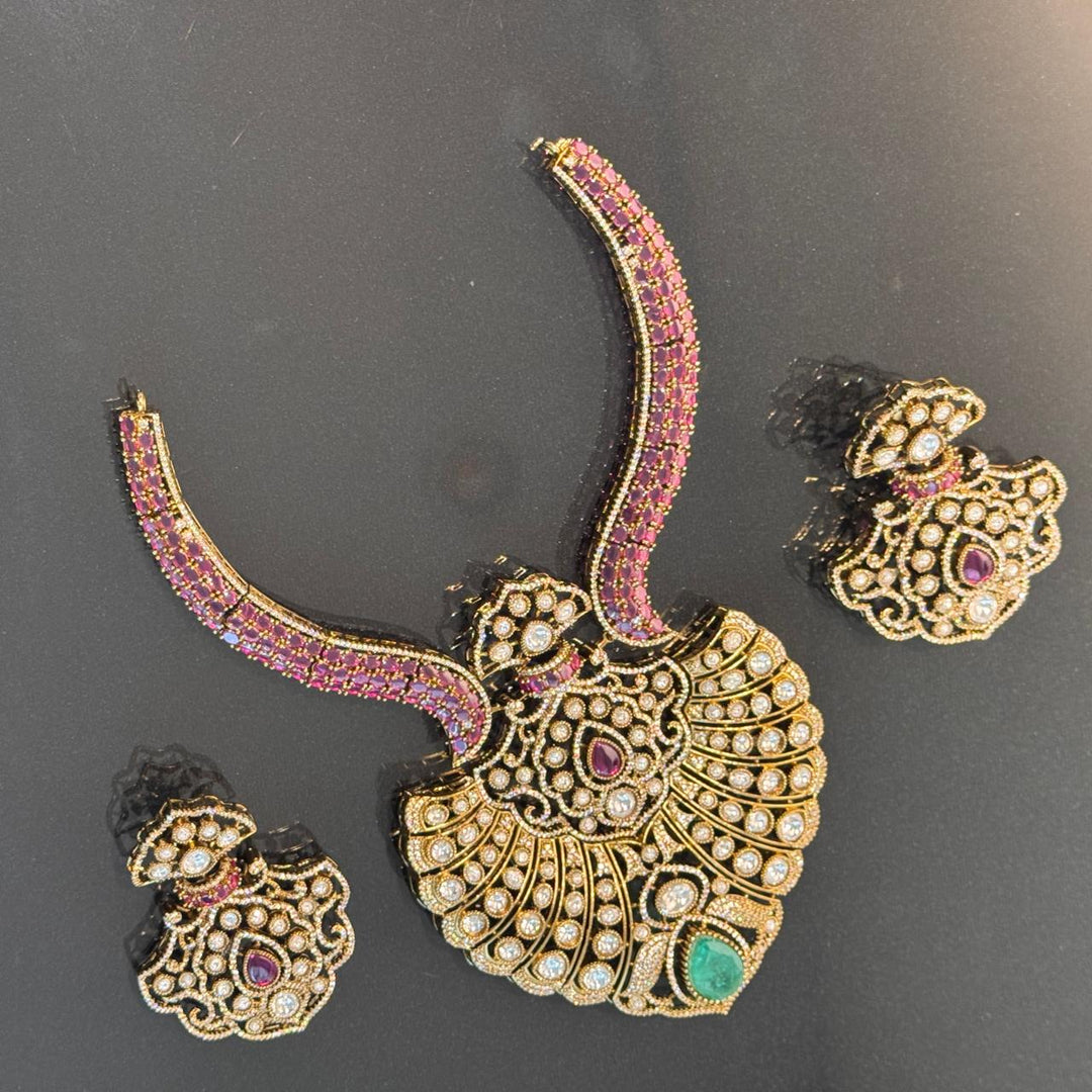 Antique Gold Finish Ruby & CZ Studded Statement Necklace Set with Emerald Accent
